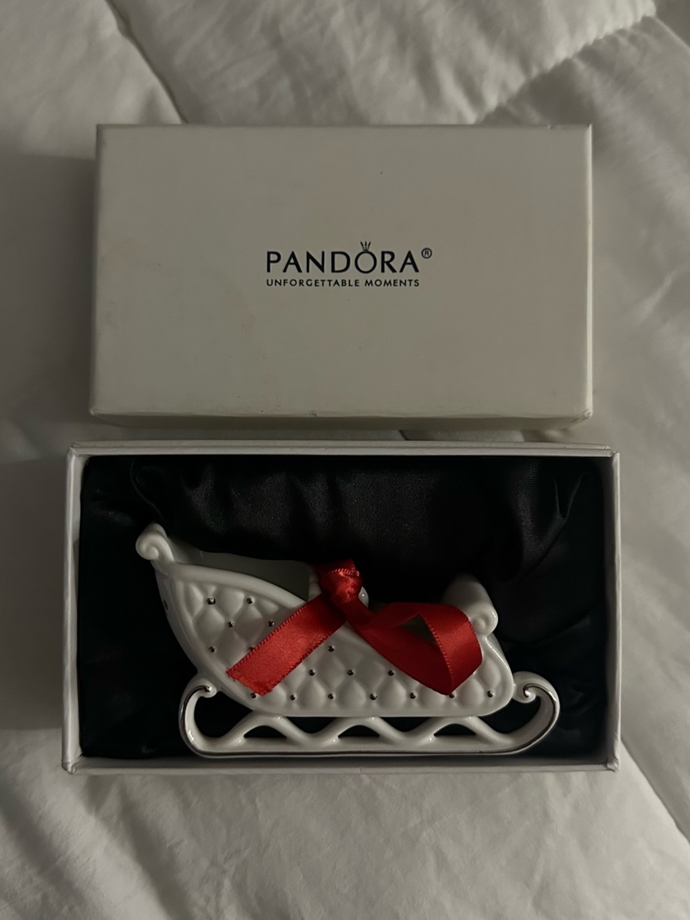 Pandora White Sleigh Ornament with Red Ribbon